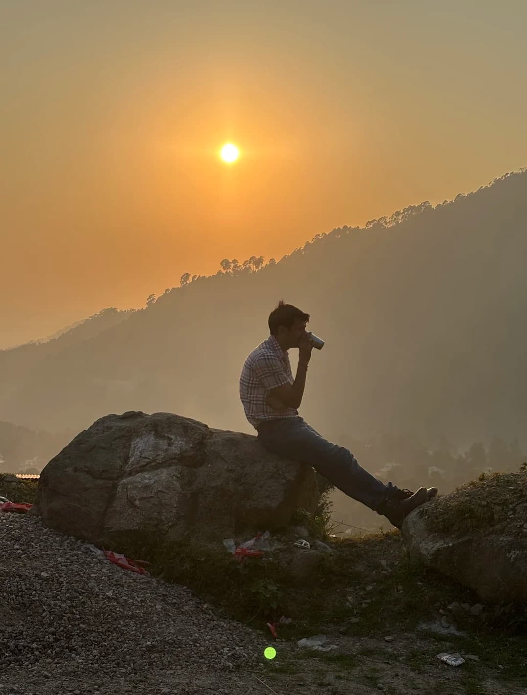 Father drinking chai on a Rock, Himachal Pradesh, 2024